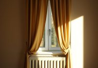 Zasłony a grzejnik: typowe błędy, które obniżają efektywność ogrzewania i komfort w domu